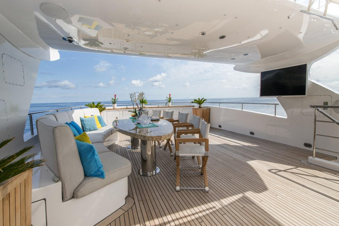 a room with a table and chairs aboard TIAMAT Yacht for Sale