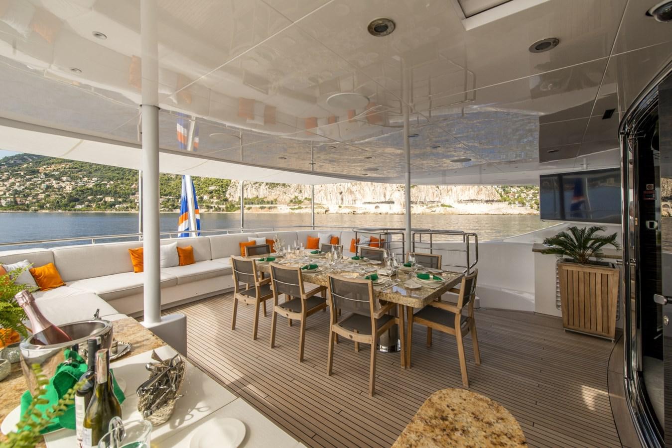 a room with a table and chairs aboard TIAMAT Yacht for Sale
