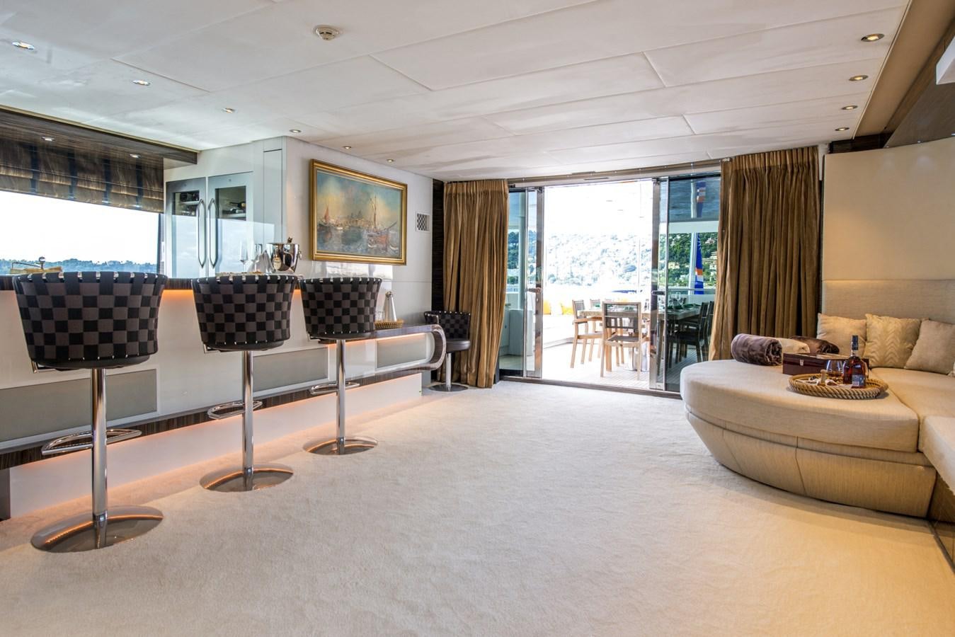 a living room with a table and chairs aboard TIAMAT Yacht for Sale