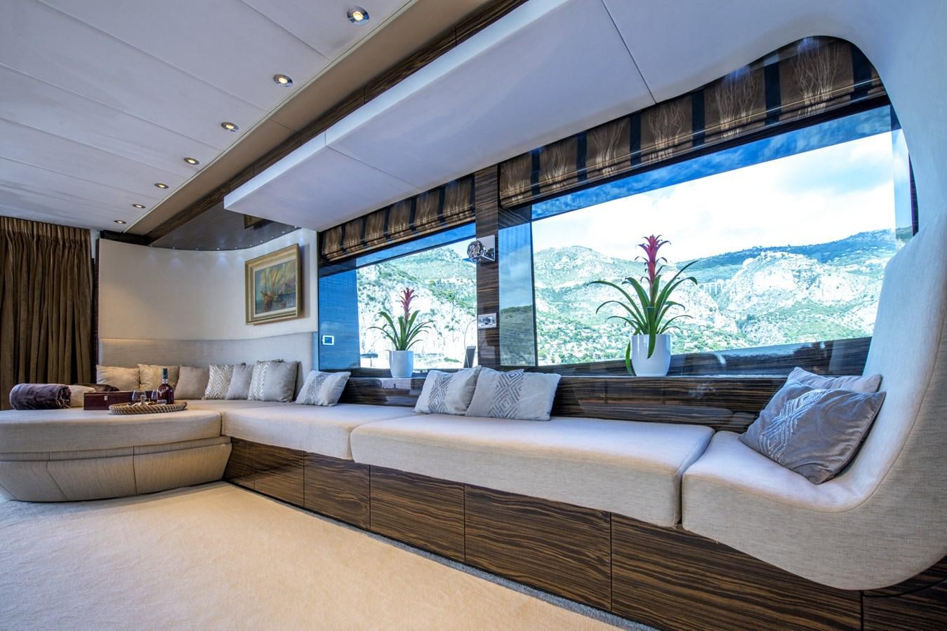 a living room with a large window aboard TIAMAT Yacht for Sale