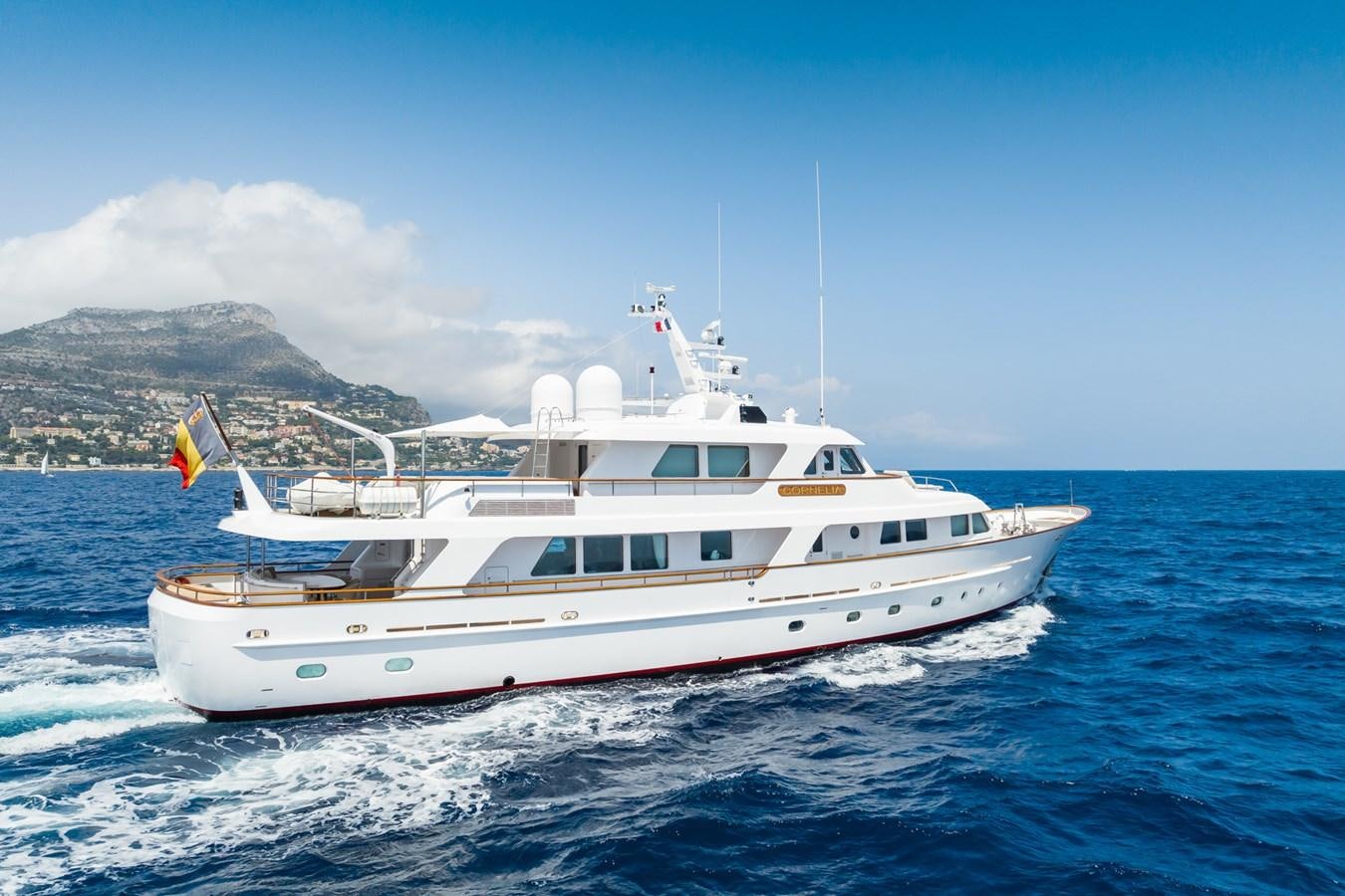 a white yacht on the water aboard CORNELIA Yacht for Sale