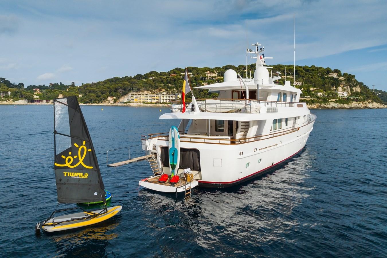 a couple of boats on the water aboard CORNELIA Yacht for Sale
