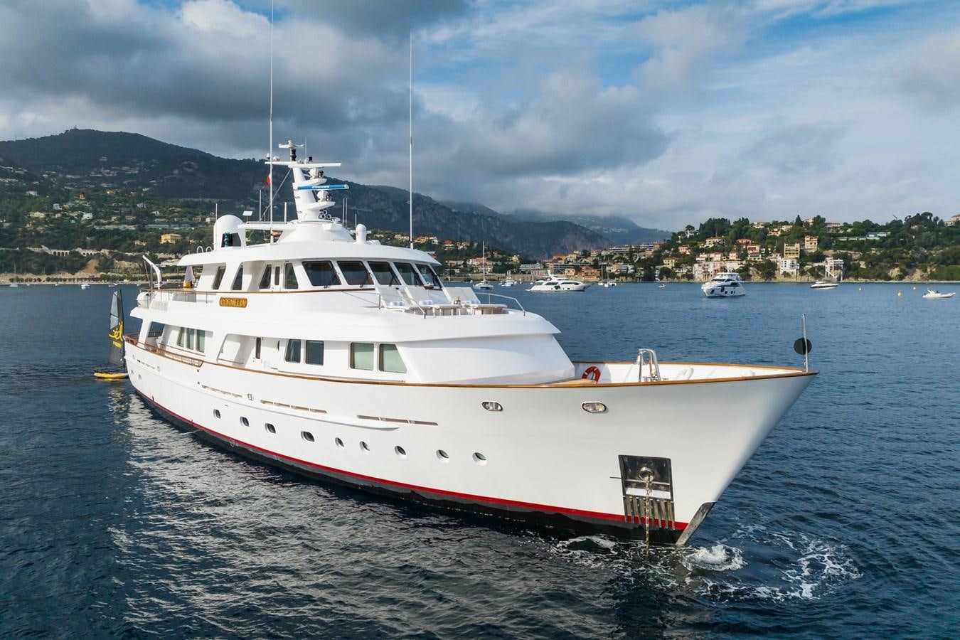 a large white boat on the water aboard CORNELIA Yacht for Sale