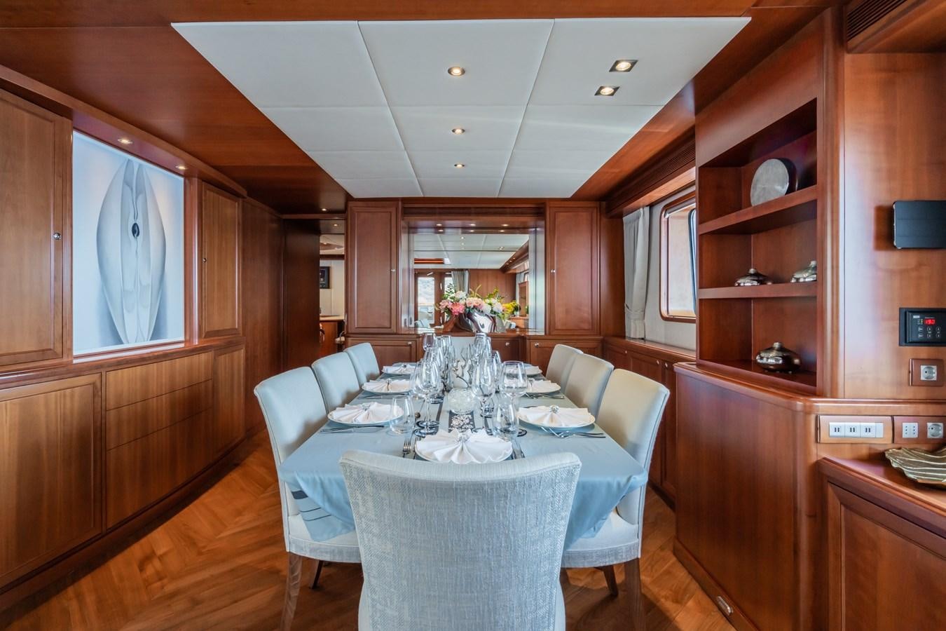 a dining room with a table aboard CORNELIA Yacht for Sale