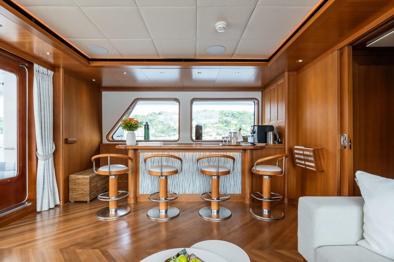 a room with stools and stools aboard CORNELIA Yacht for Sale