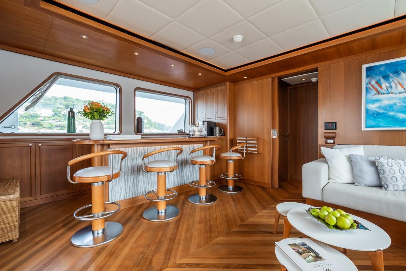 a modern looking kitchen with a large island aboard CORNELIA Yacht for Sale