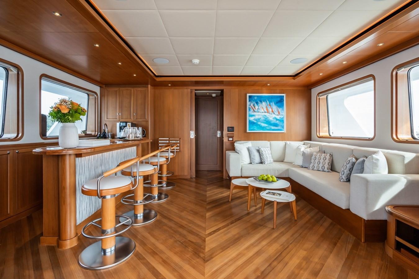 a living room with a couch and a table aboard CORNELIA Yacht for Sale