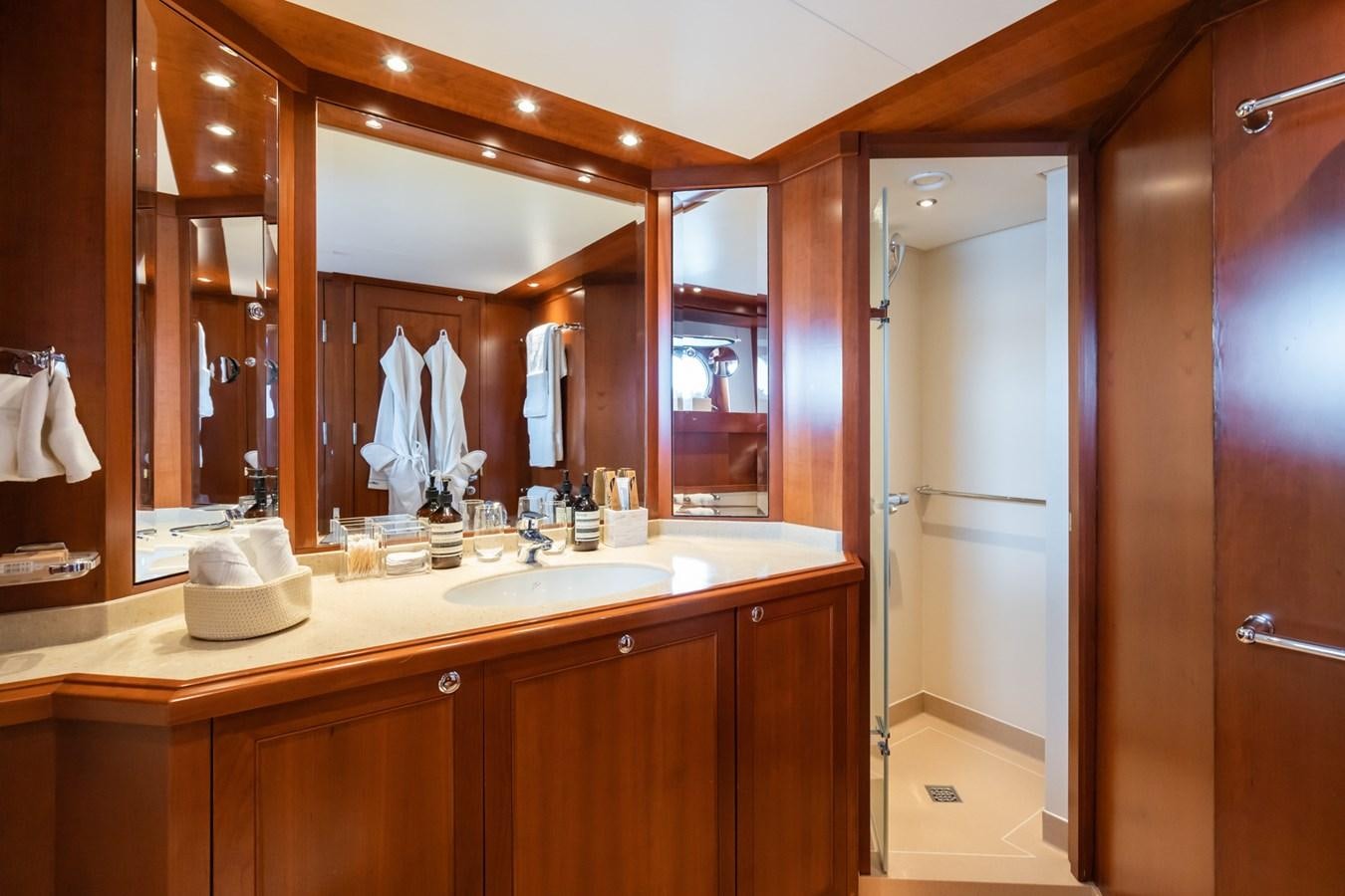 a bathroom with a large mirror aboard CORNELIA Yacht for Sale