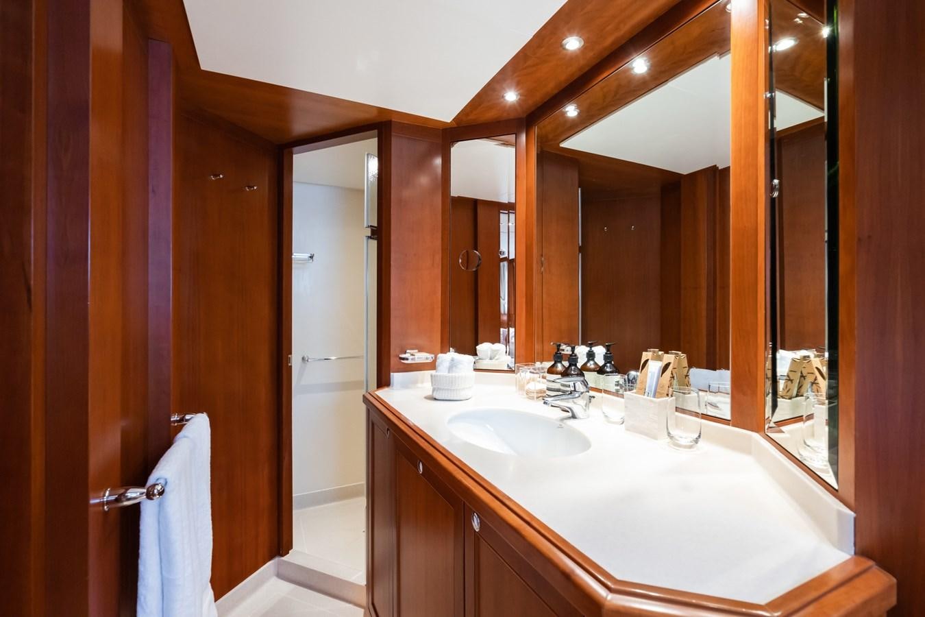 a bathroom with a sink and a mirror aboard CORNELIA Yacht for Sale