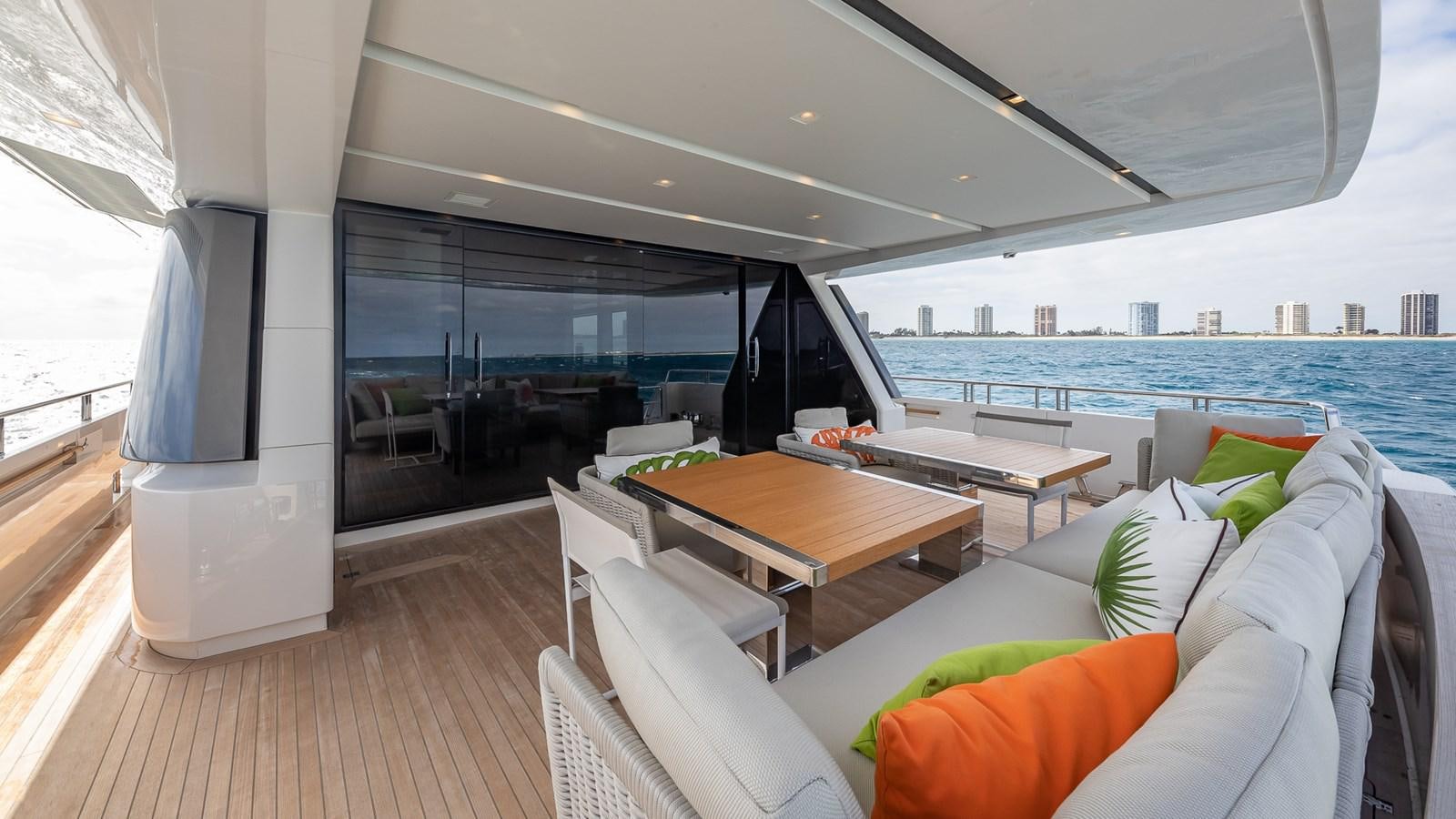 a room with a table and chairs aboard XWAVE Yacht for Sale
