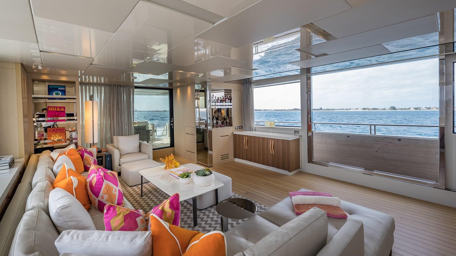 a living room with a large window aboard XWAVE Yacht for Sale