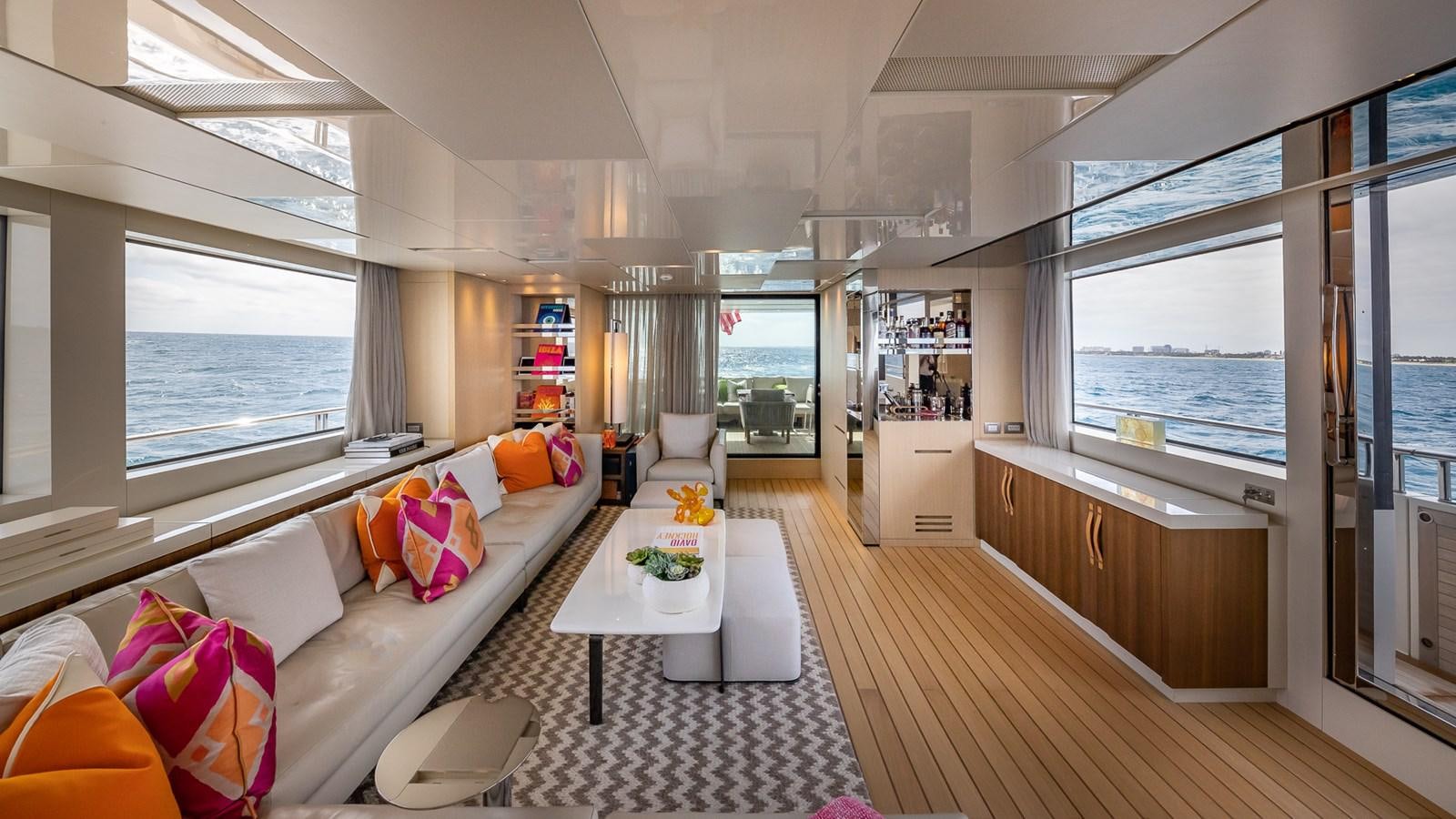 a living room with a large window aboard XWAVE Yacht for Sale