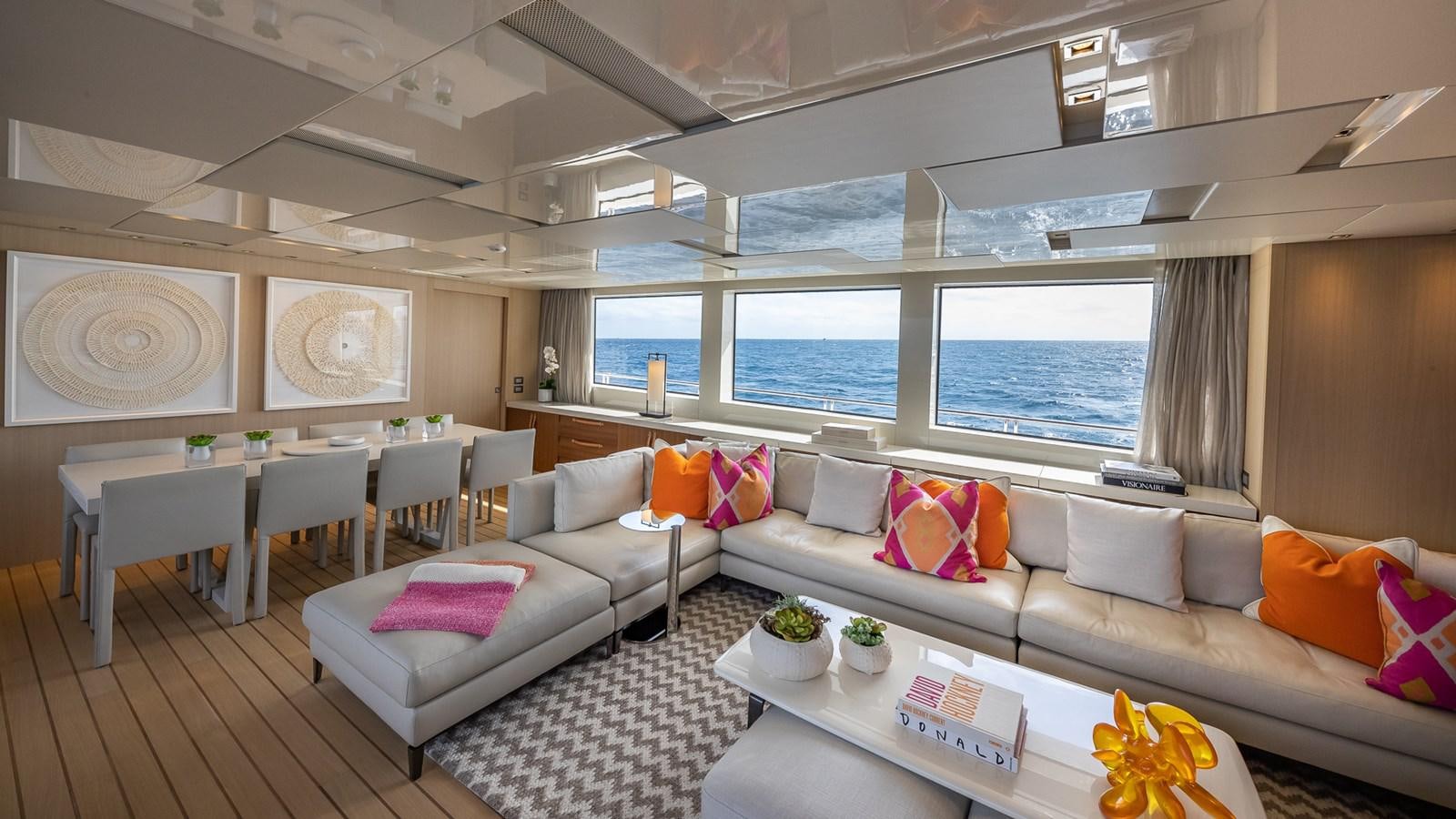 a living room with a large window aboard XWAVE Yacht for Sale