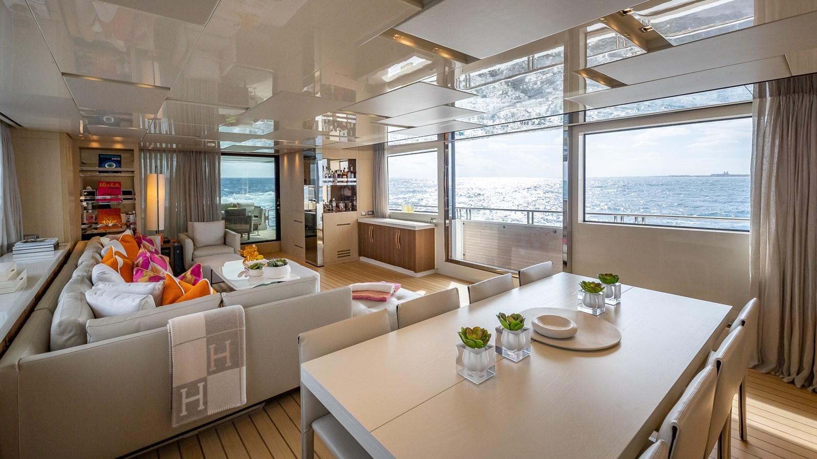a living room with a large window aboard XWAVE Yacht for Sale