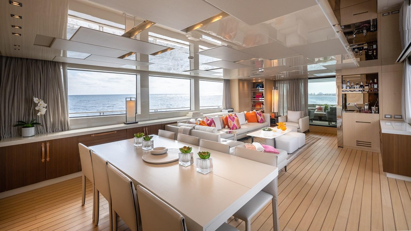 a large living room with a large window aboard XWAVE Yacht for Sale