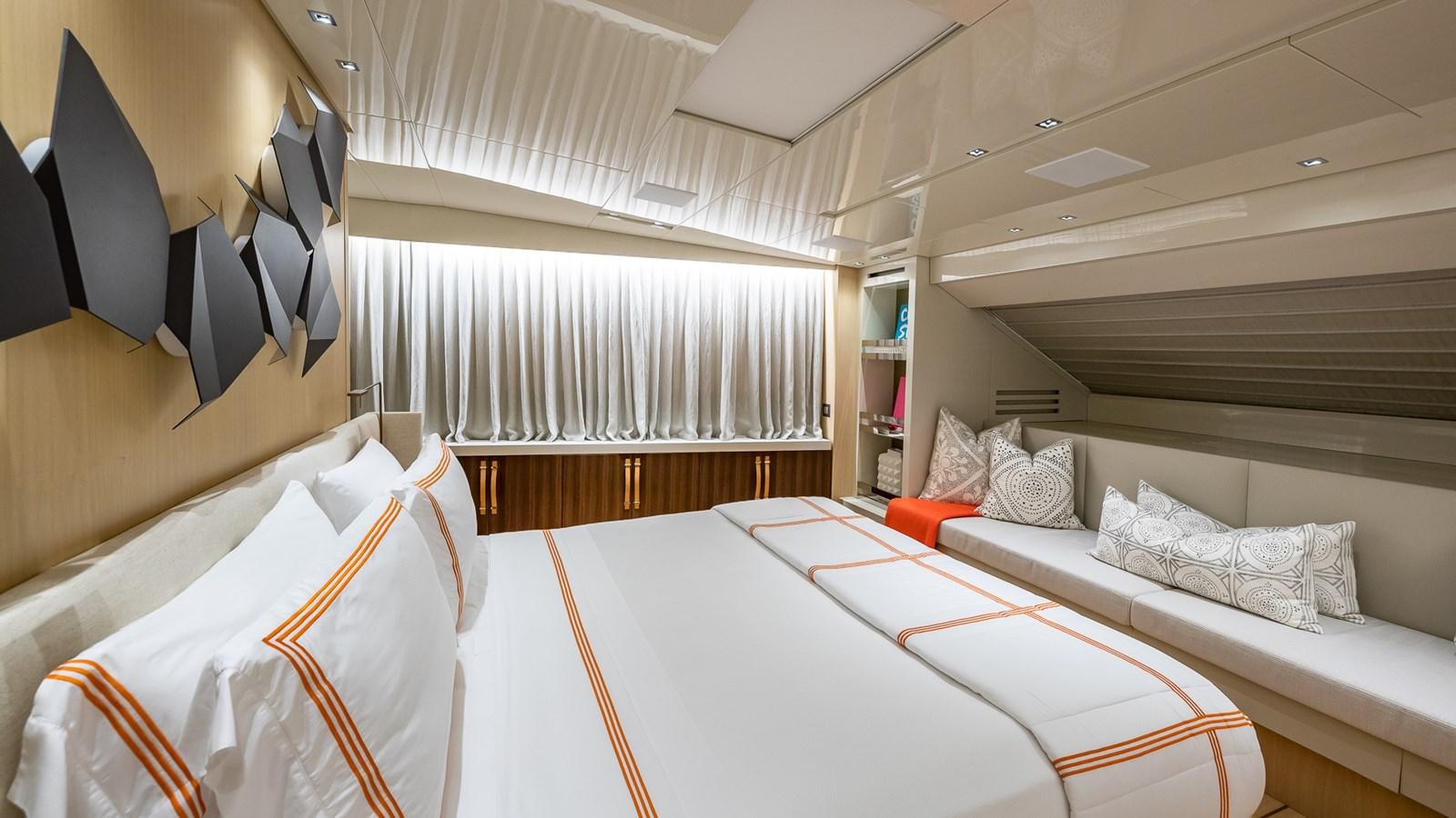 a room with beds and a window aboard XWAVE Yacht for Sale