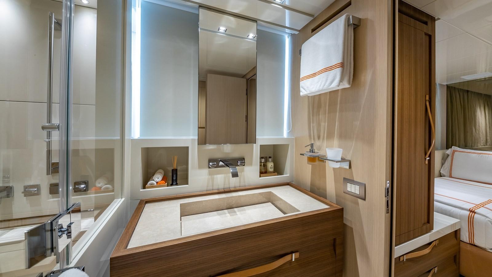 a bathroom with a large mirror aboard XWAVE Yacht for Sale