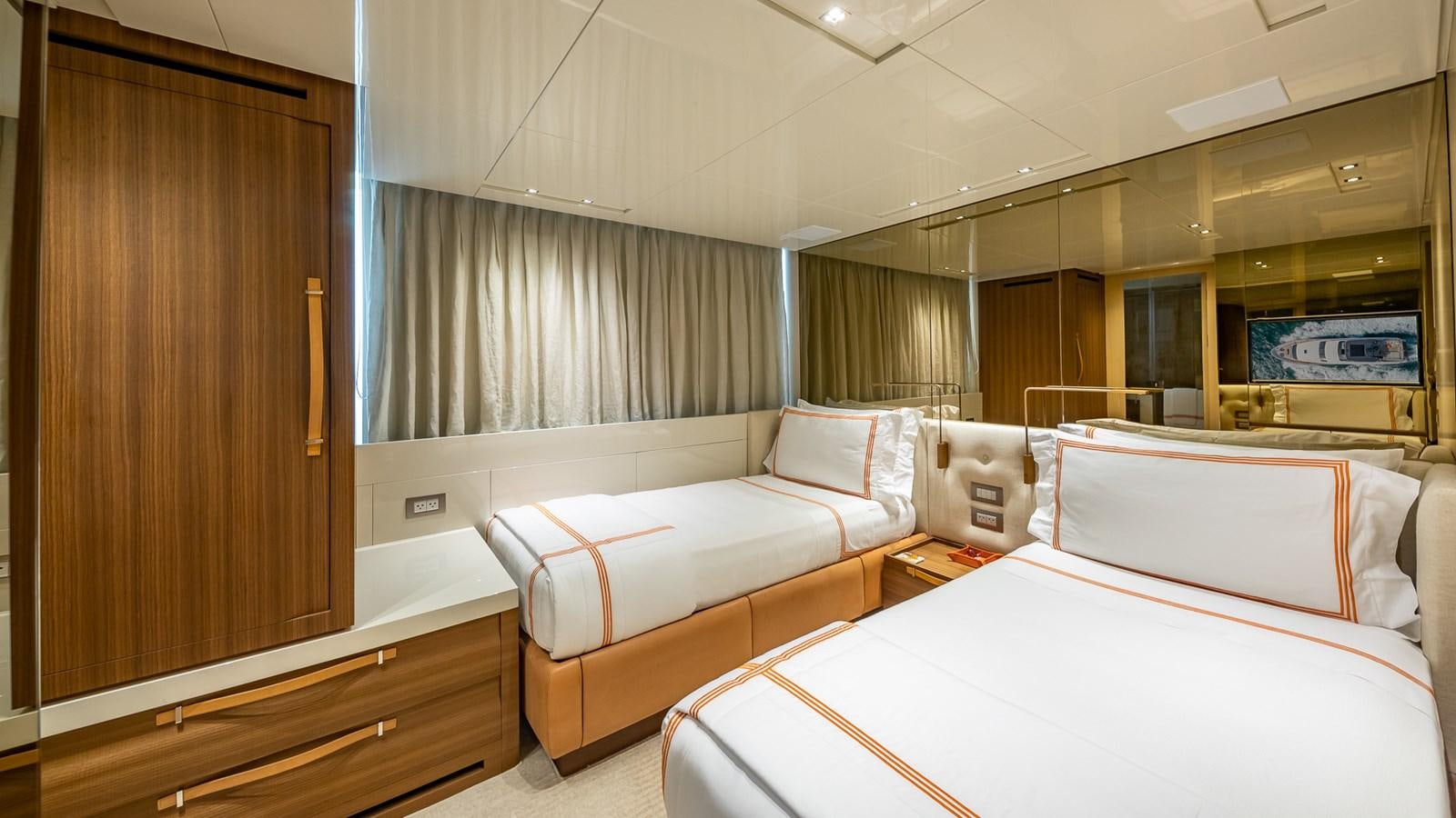 a room with two beds aboard XWAVE Yacht for Sale