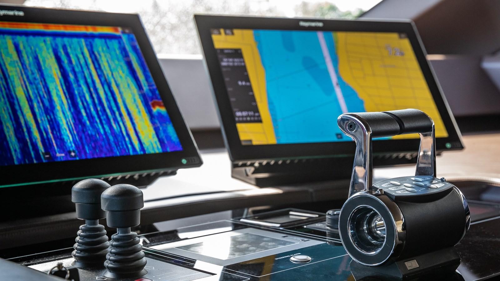 a camera on a table aboard XWAVE Yacht for Sale