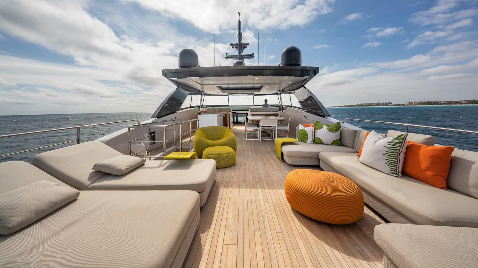 a deck with a large boat and a large black boat on it aboard XWAVE Yacht for Sale