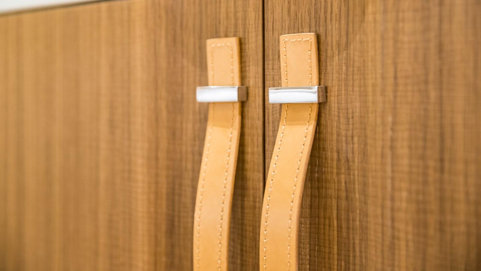 a group of keys on a wood surface aboard XWAVE Yacht for Sale