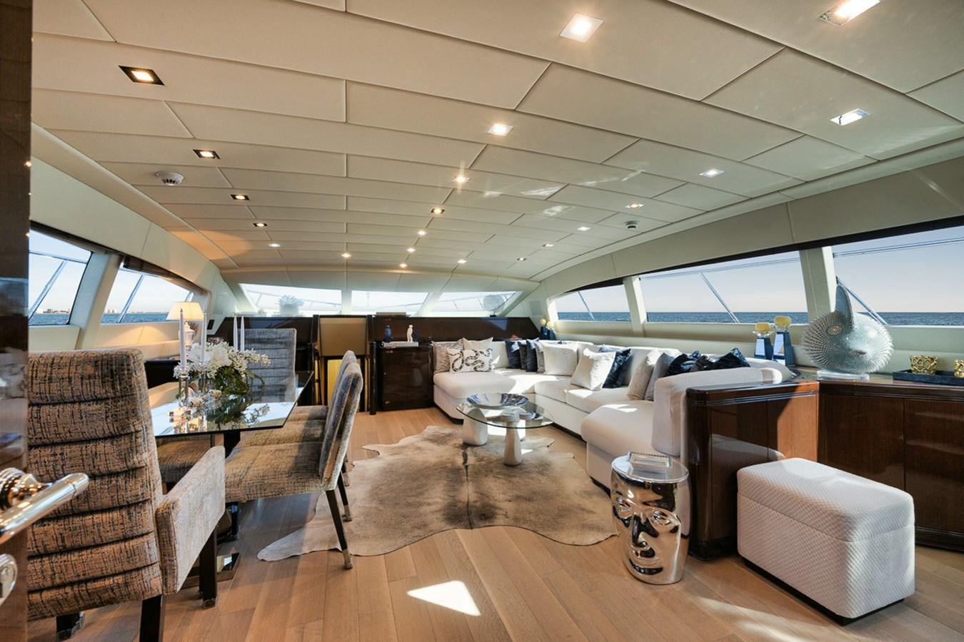a room with a couch and a table and chairs aboard TATAMI Yacht for Sale