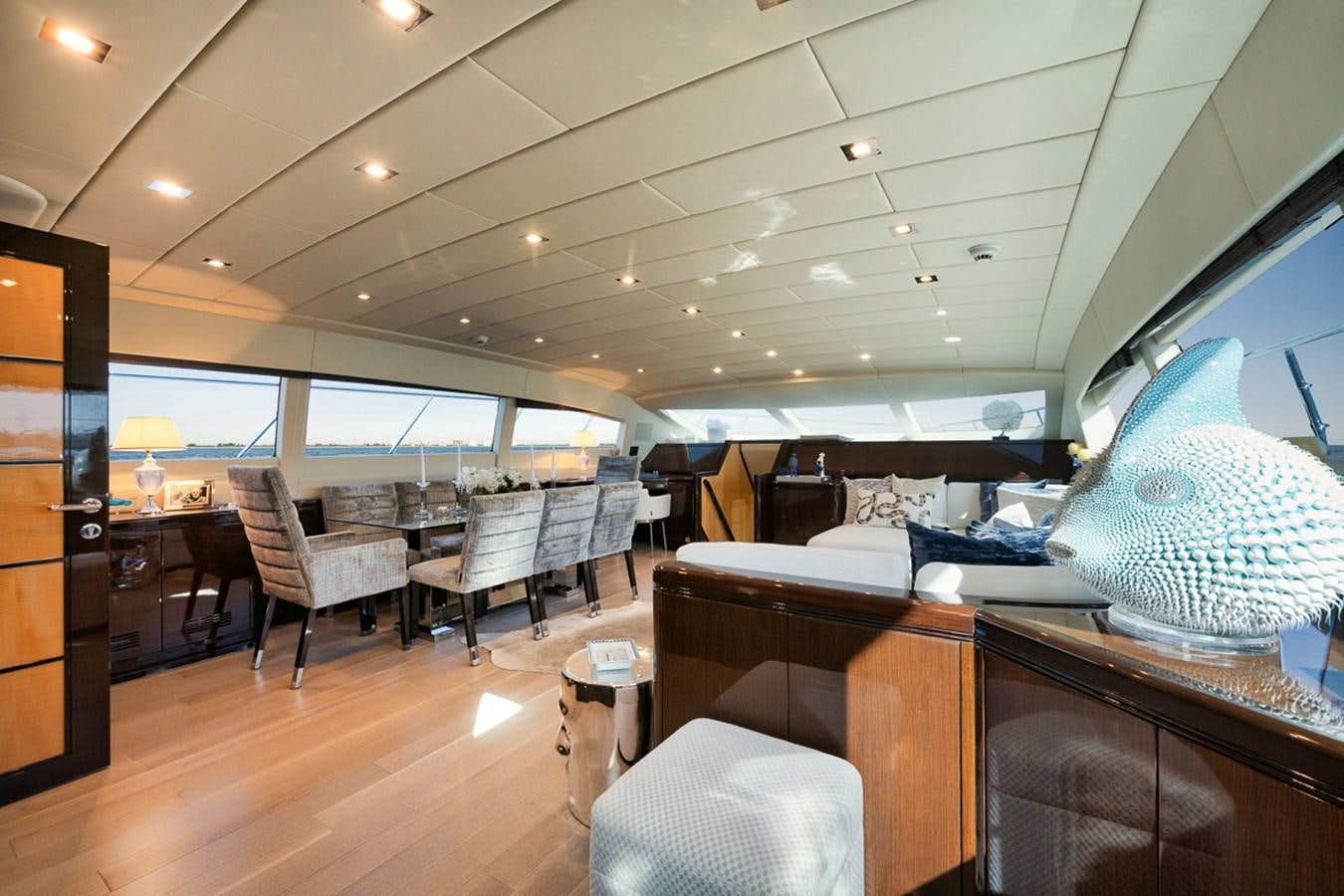 a room with a large mirror and a large blue globe on the ceiling aboard TATAMI Yacht for Sale