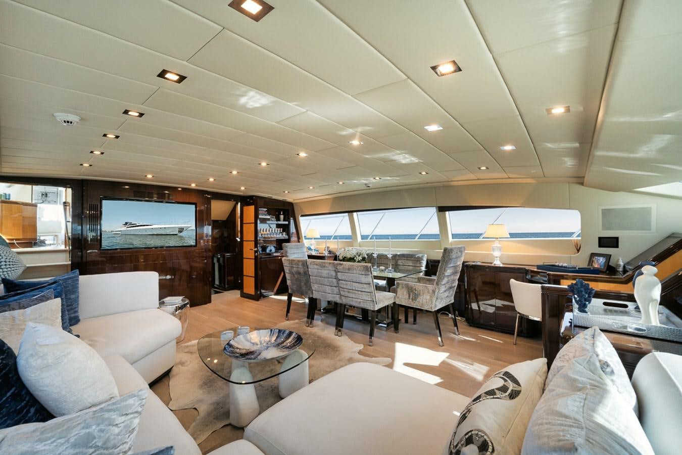 a room with a couch and a table and chairs aboard TATAMI Yacht for Sale
