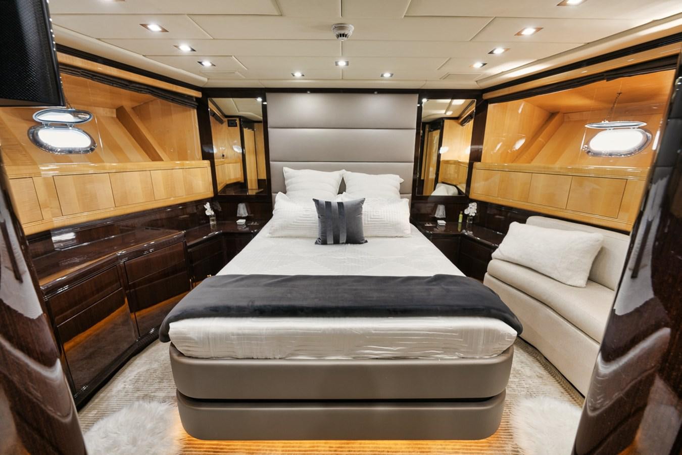 a room with a bed and a couch aboard TATAMI Yacht for Sale