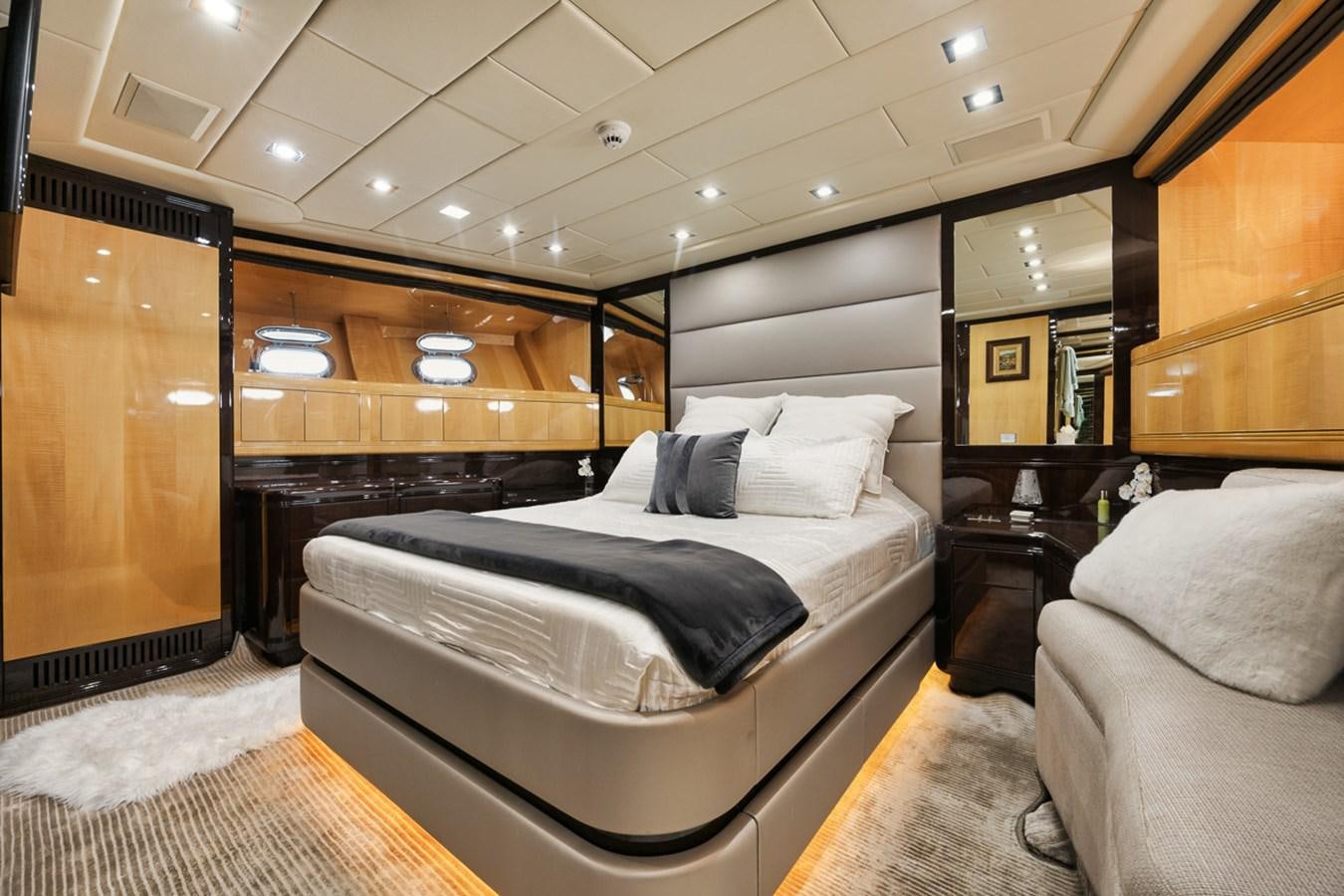 a room with a bed and a couch aboard TATAMI Yacht for Sale