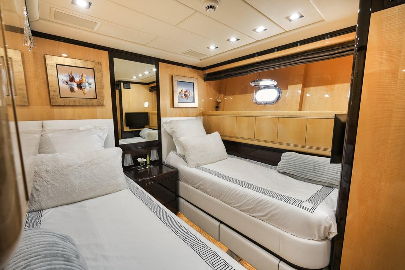 a room with a bed and a desk aboard TATAMI Yacht for Sale