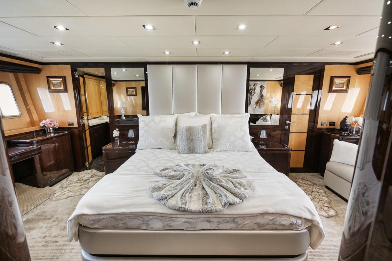 a large bed in a hotel room aboard TATAMI Yacht for Sale