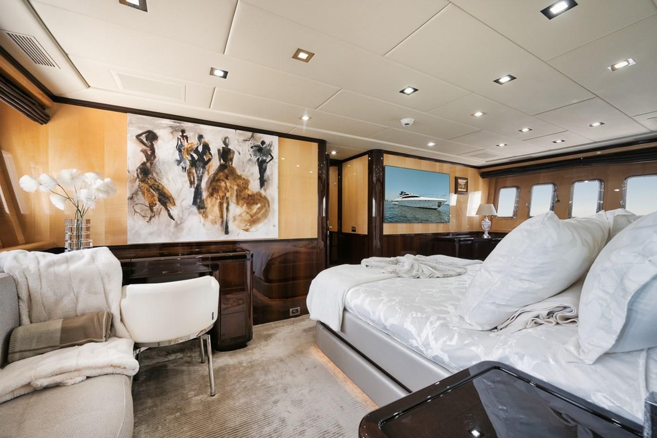 a room with a bed and a television aboard TATAMI Yacht for Sale