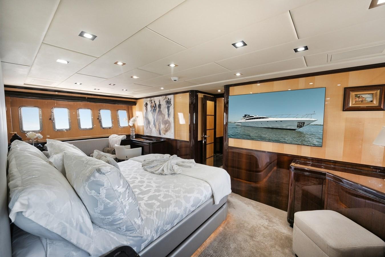 a room with a bed and a television aboard TATAMI Yacht for Sale