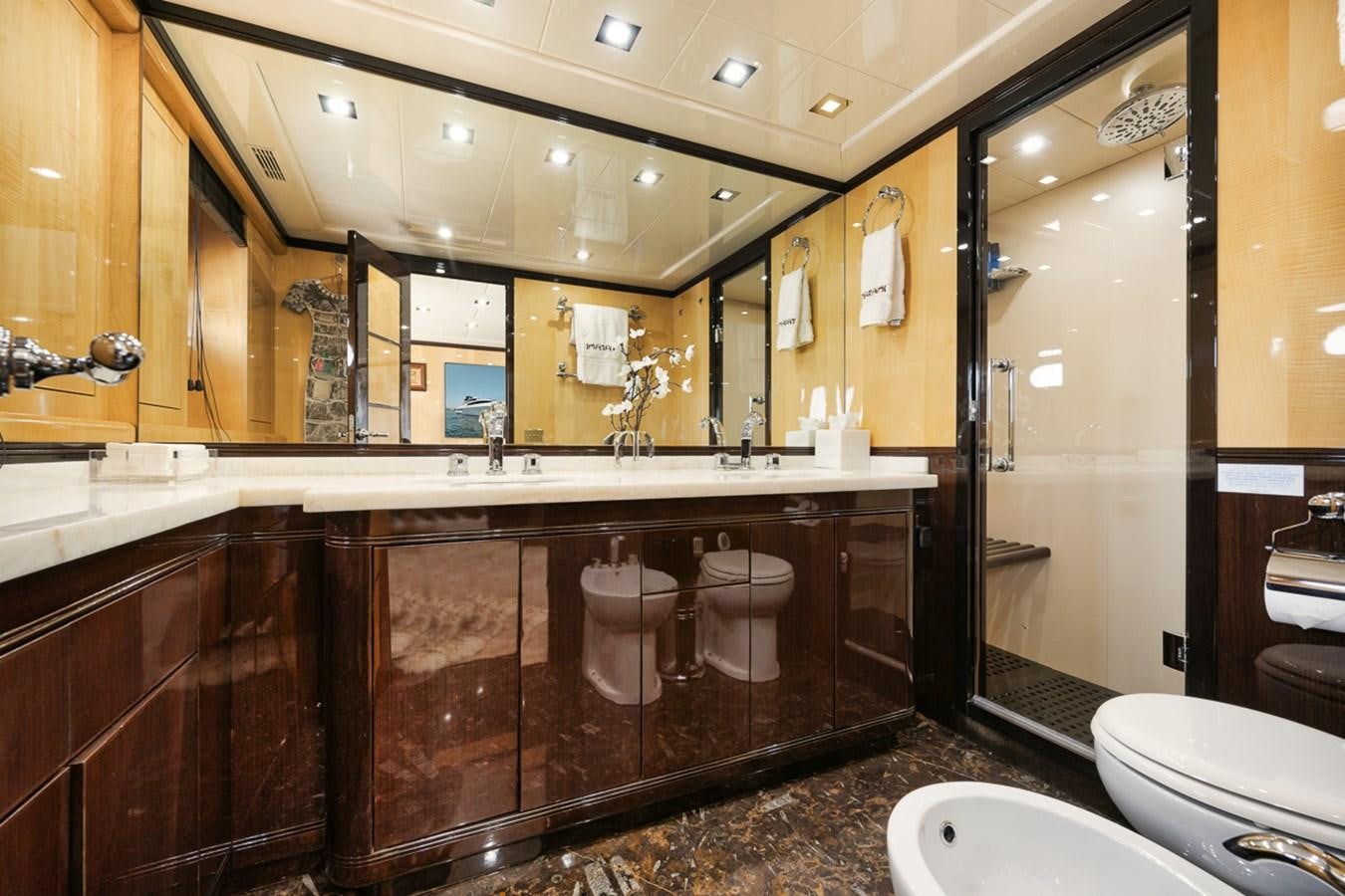 a bathroom with a large marble countertop aboard TATAMI Yacht for Sale