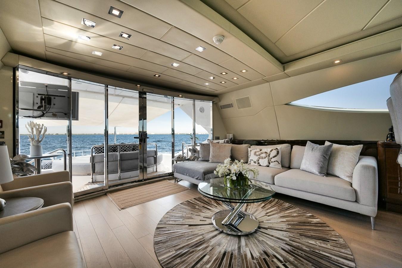 a living room with a large glass door aboard TATAMI Yacht for Sale