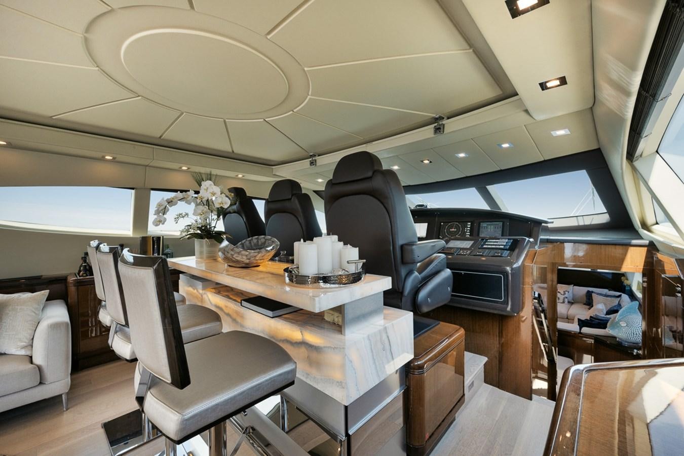 a room with a table chairs and a couch aboard TATAMI Yacht for Sale