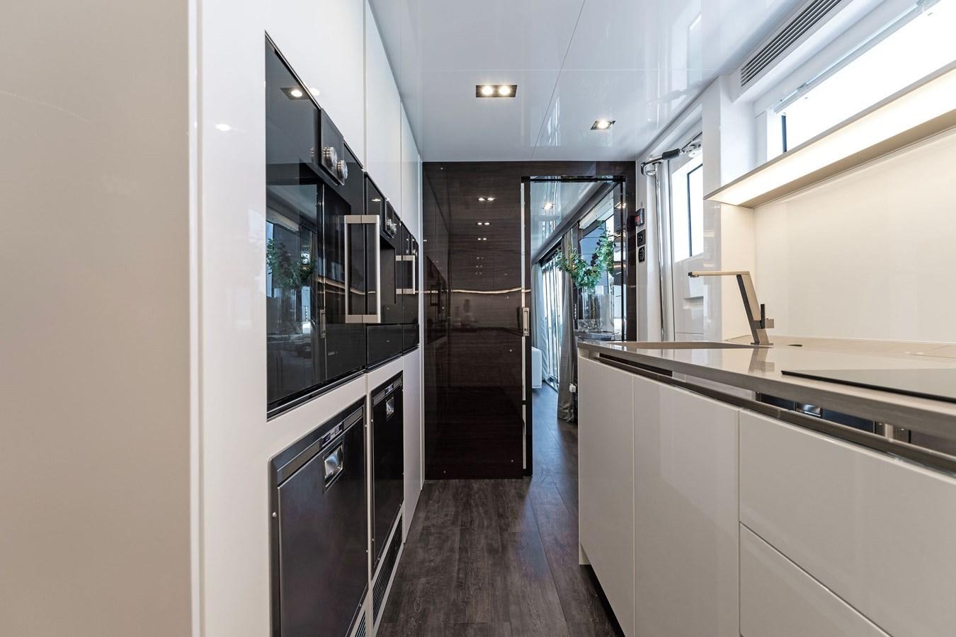 a kitchen with a wood floor aboard FOR DISPLAY ONLY Yacht for Sale