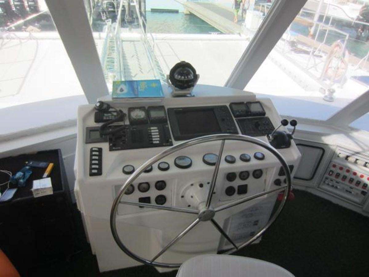 a white console with a black knob aboard ECOLORATO Yacht for Sale