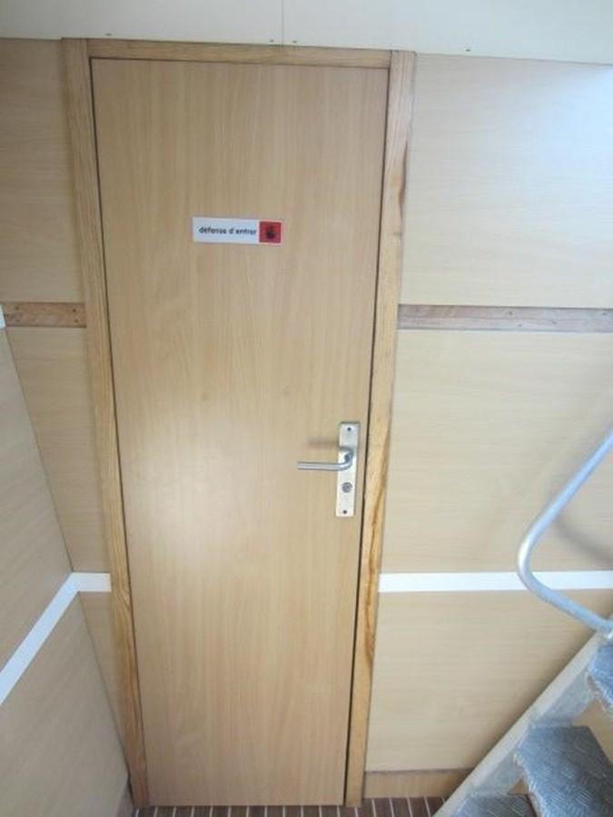 a wooden cabinet in a room aboard ECOLORATO Yacht for Sale