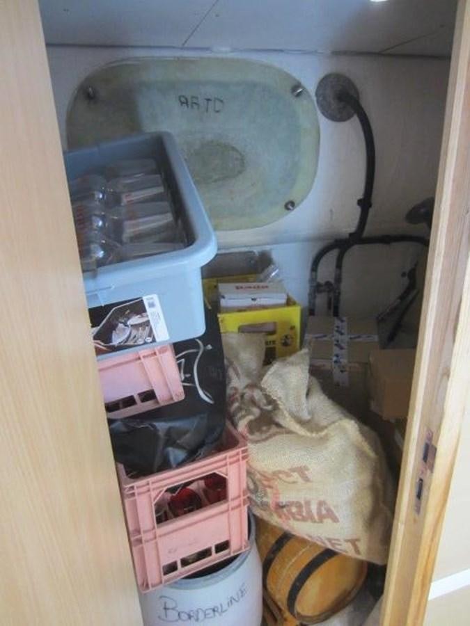 a small refrigerator with a bunch of food in it aboard ECOLORATO Yacht for Sale