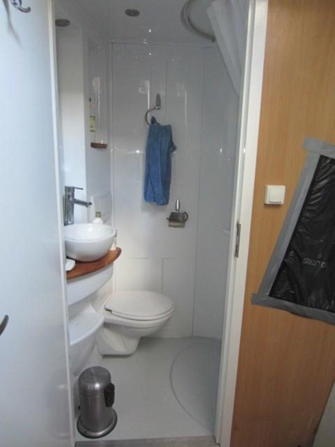a bathroom with a sink toilet and a mirror aboard ECOLORATO Yacht for Sale