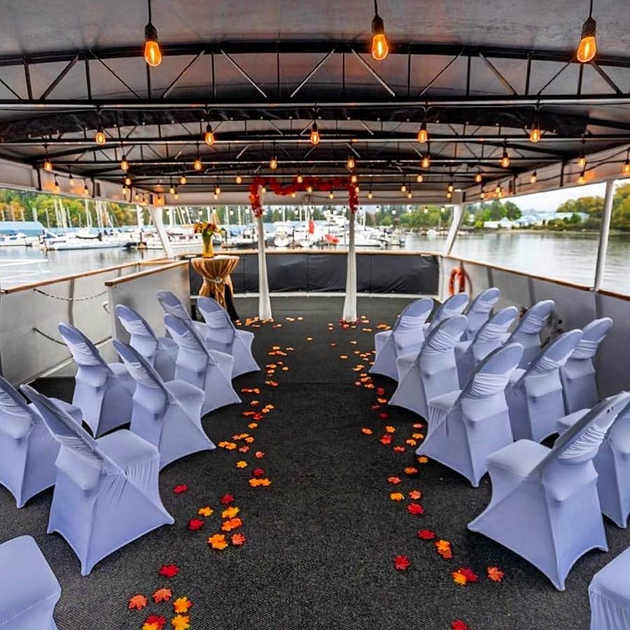 a large room with rows of white chairs and tables aboard MAGIC CHARM Yacht for Sale