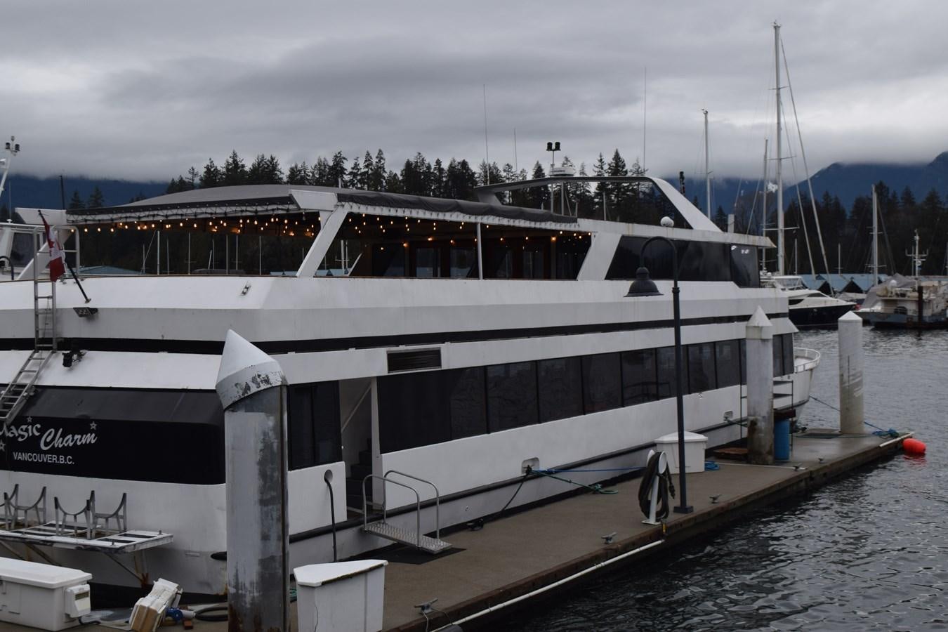 a boat docked at a pier aboard MAGIC CHARM Yacht for Sale