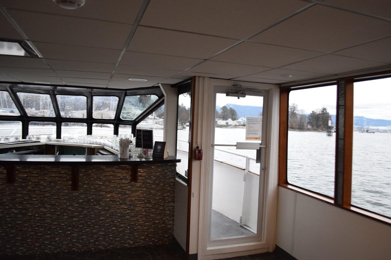 a room with a large window and a desk with a computer on it aboard MAGIC CHARM Yacht for Sale