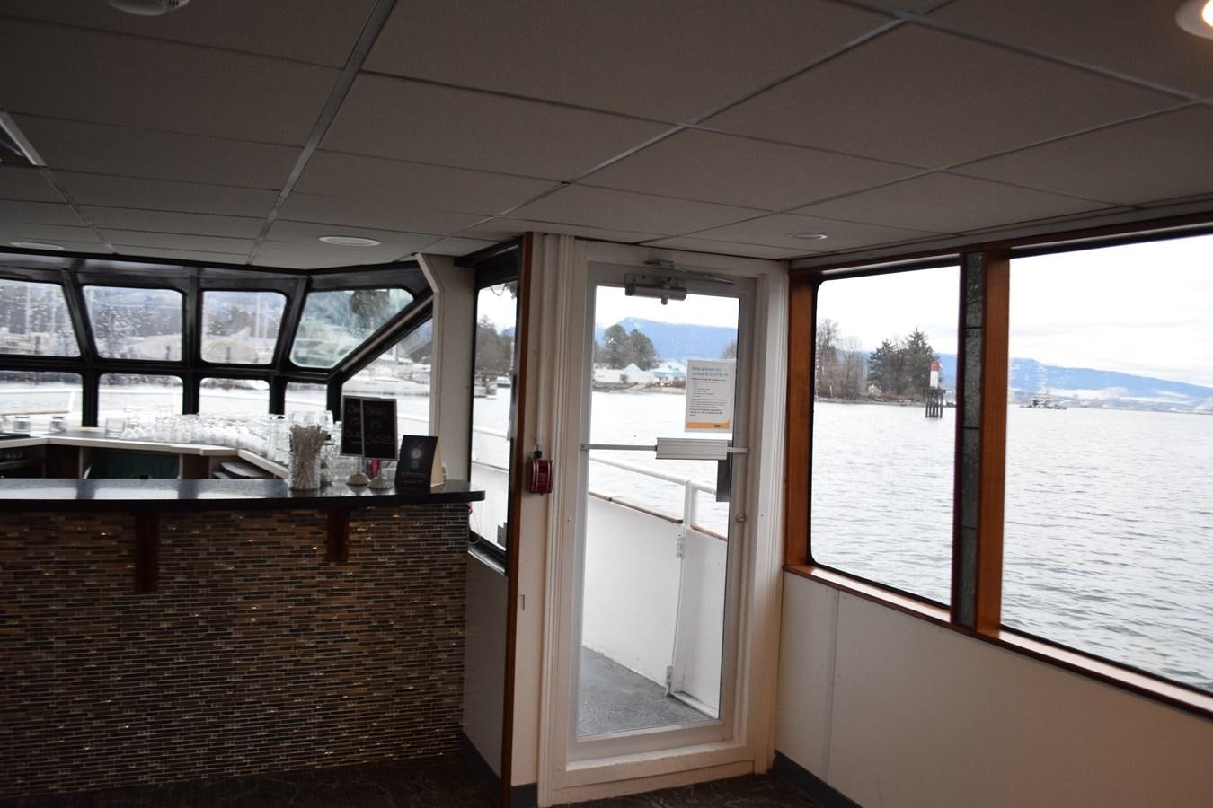 a room with a view of the ocean and the beach aboard MAGIC CHARM Yacht for Sale