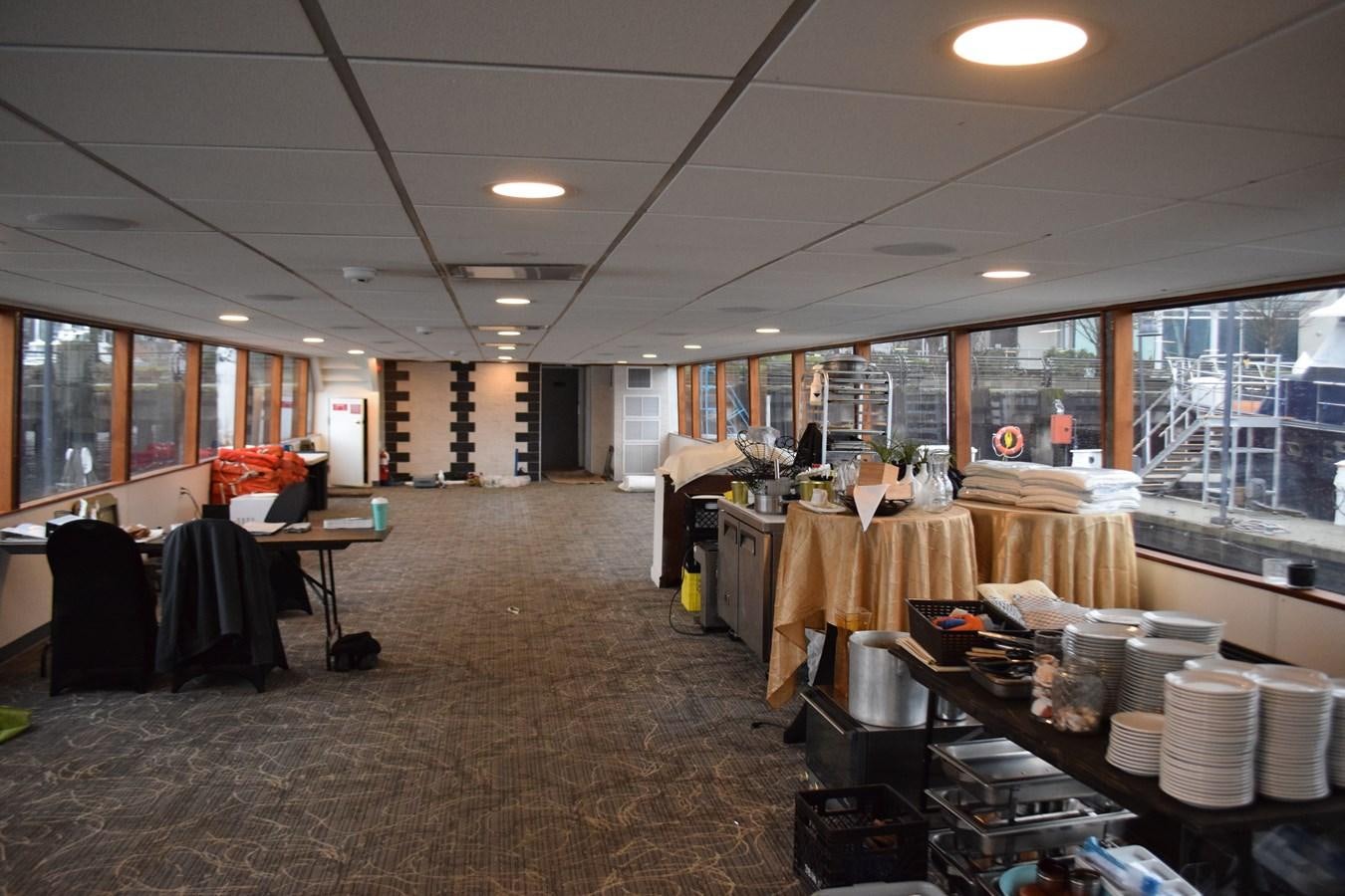 a large kitchen with a table and chairs aboard MAGIC CHARM Yacht for Sale