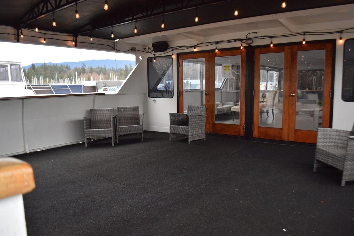 a room with chairs and a table aboard MAGIC CHARM Yacht for Sale