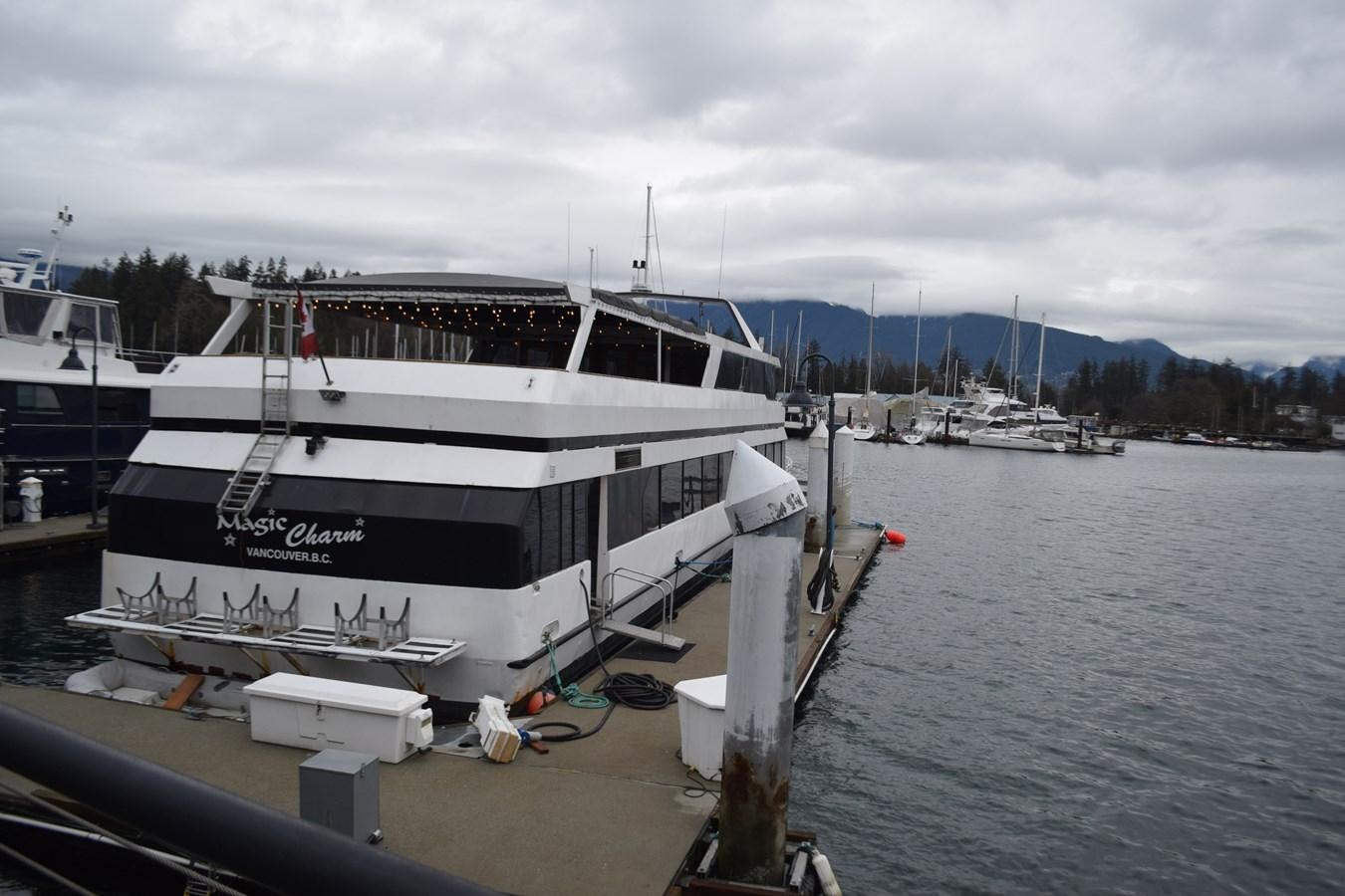 a boat docked at a pier aboard MAGIC CHARM Yacht for Sale