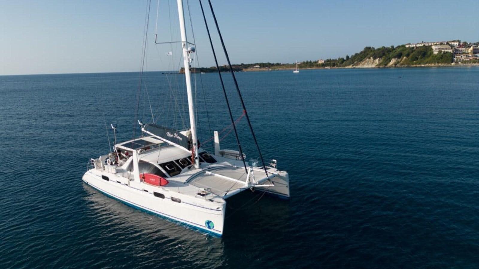 a white boat on the water aboard BLUE MOON Yacht for Sale